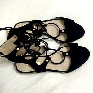 Louise et Cie Lo- Ashlyn kid suede lace up sandal; black with gold accents.
